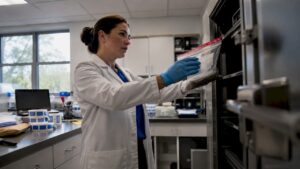 Forensic specialist securing evidence in lab locker