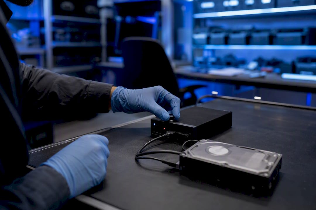 What is recovery in computer forensics for legal evidence? 1 Hardware write-blocker connected to hard drive